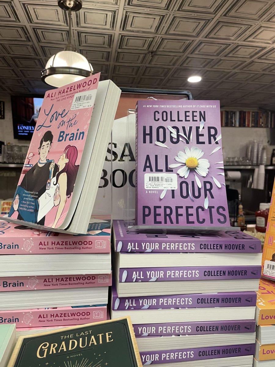 Copies of Colleen Hoover’s “All Your Perfects” are displayed in Trident Booksellers & Cafe in Boston. Hoover was criticized for romanticizing domestic violence in many of her books, which have become popular on TikTok.