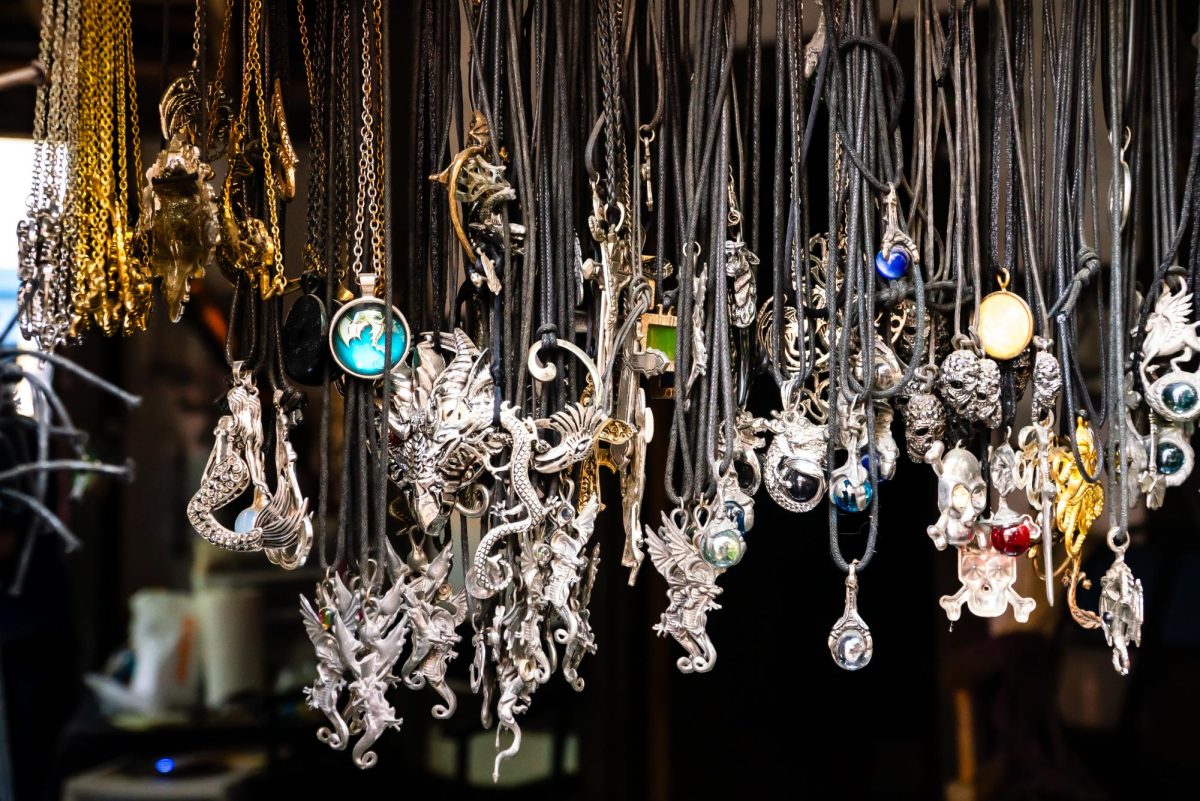 A vendor displays necklaces at their booth. Jewelry, Celtic clothing and pottery were just some items that could be purchased at the fair. 