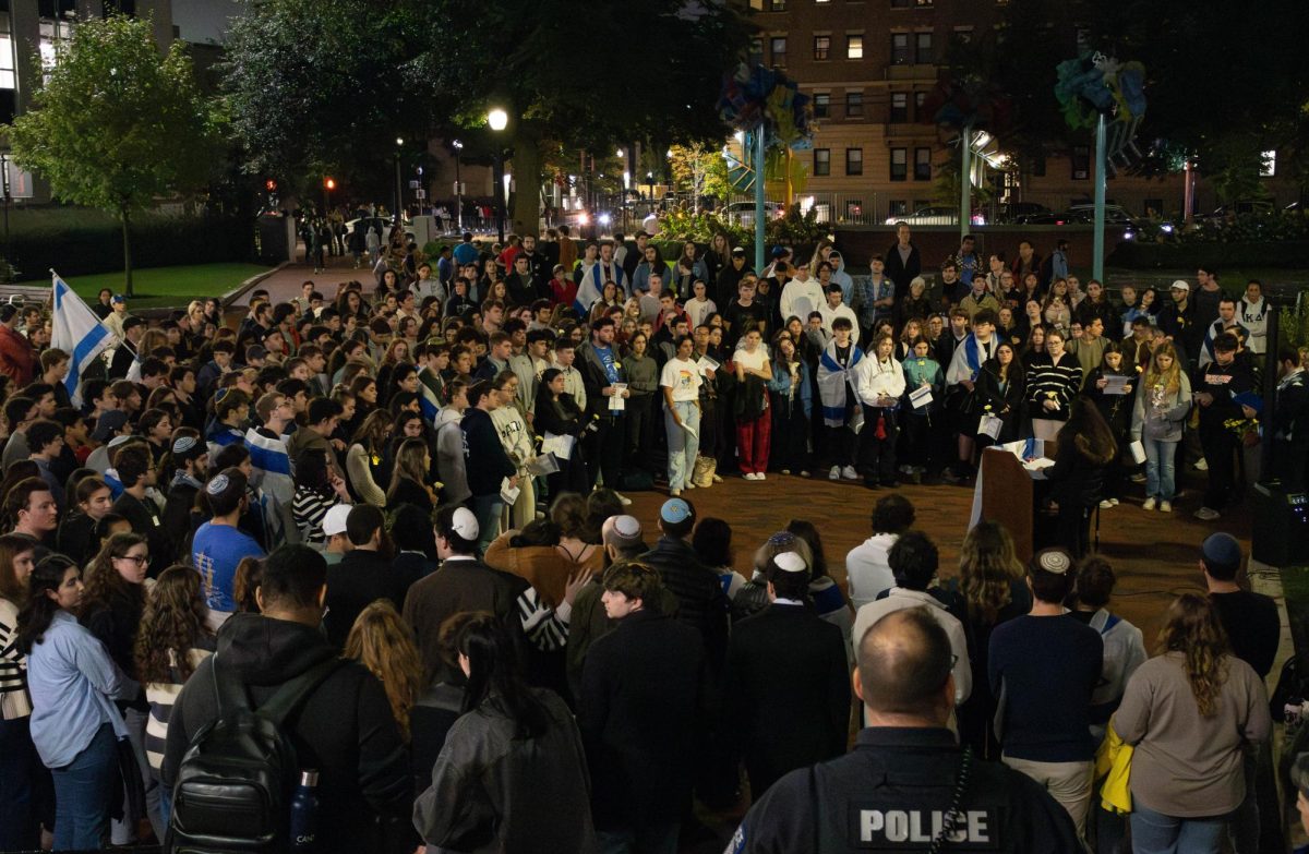 Students partake in a vigil commemorating the one-year anniversary of Hamas’ attacks on Israel. The vigil was hosted by Northeastern Hillel.