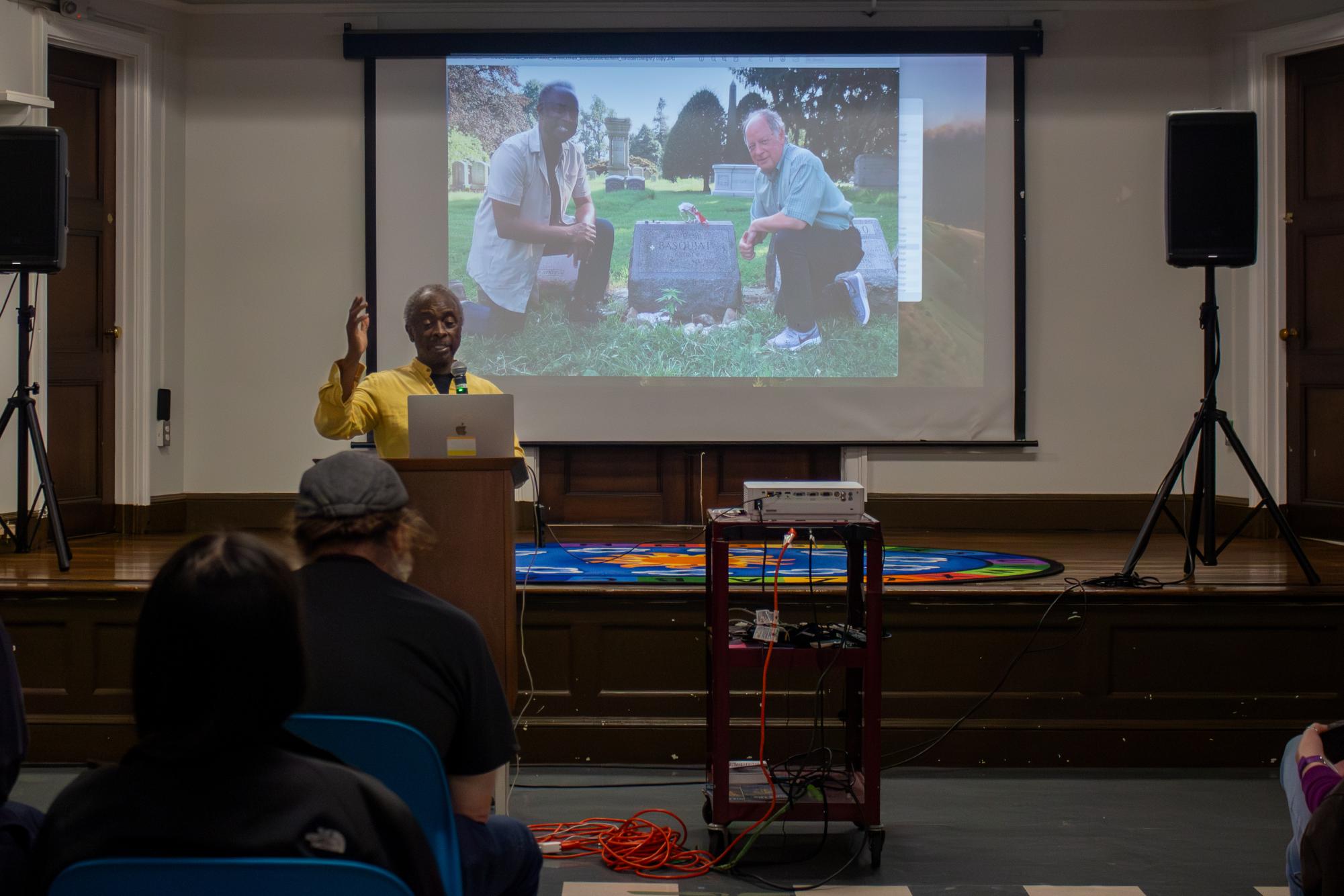 Roberto Mighty speaks to an audience about his docuseries “World’s Greatest Cemeteries." Mighty traveled to cemeteries around the world while researching for his docuseries.