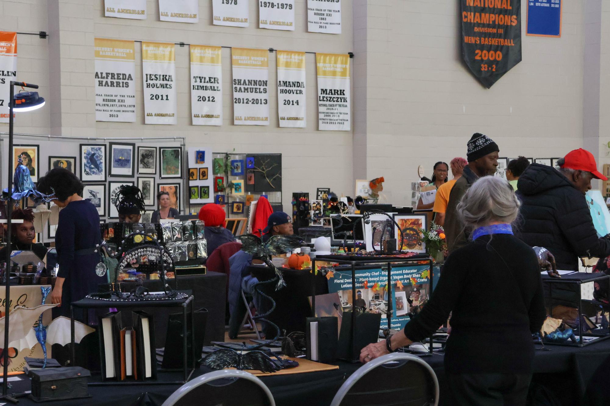 Attendees look through booths at the 25th Roxbury Open Studios festival. The festival aimed to highlight artistic talent within Roxbury and foster community.