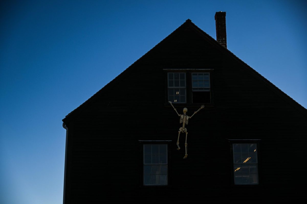 A skeleton decoration dangles from the ledge of a window off a building in Salem’s Derby Wharf area. Other historical areas, including Derby Wharf, joined in on the Halloween fun, with one house boasting tentacles out of its windows and a ship in its harbor showcasing a plastic life-size skeleton dressed in a life jacket.