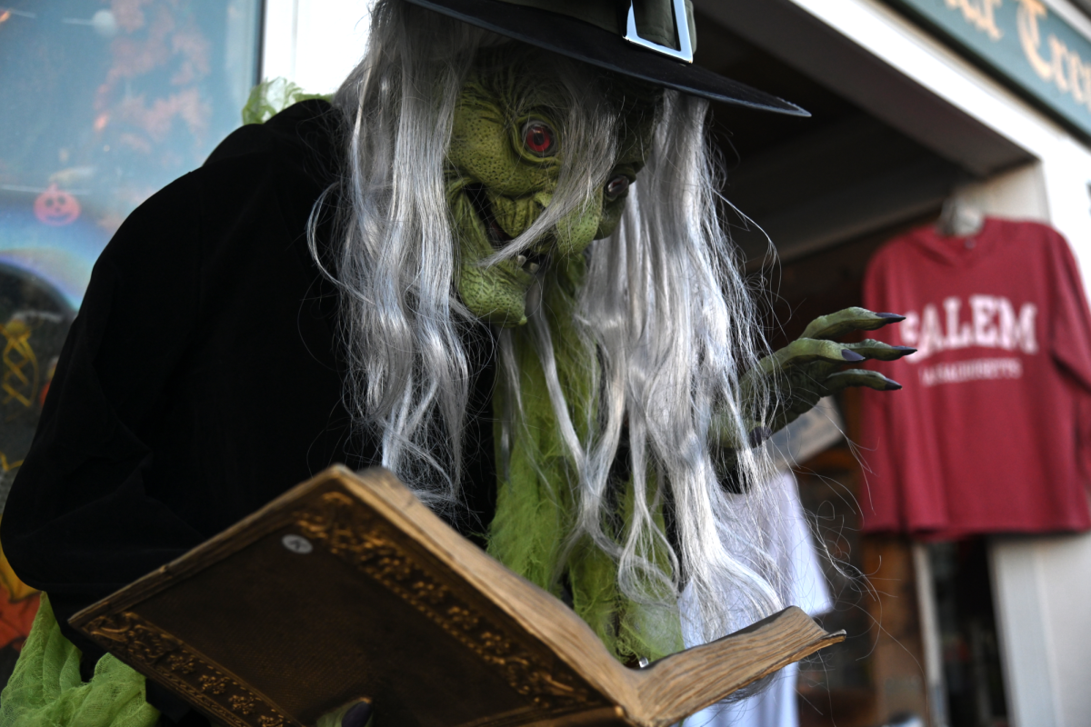 A statue of a witch reading a book stands on a main street in Salem. Various places in and around Boston provided spooky activities for visitors who prefer a scary Halloween experience. 