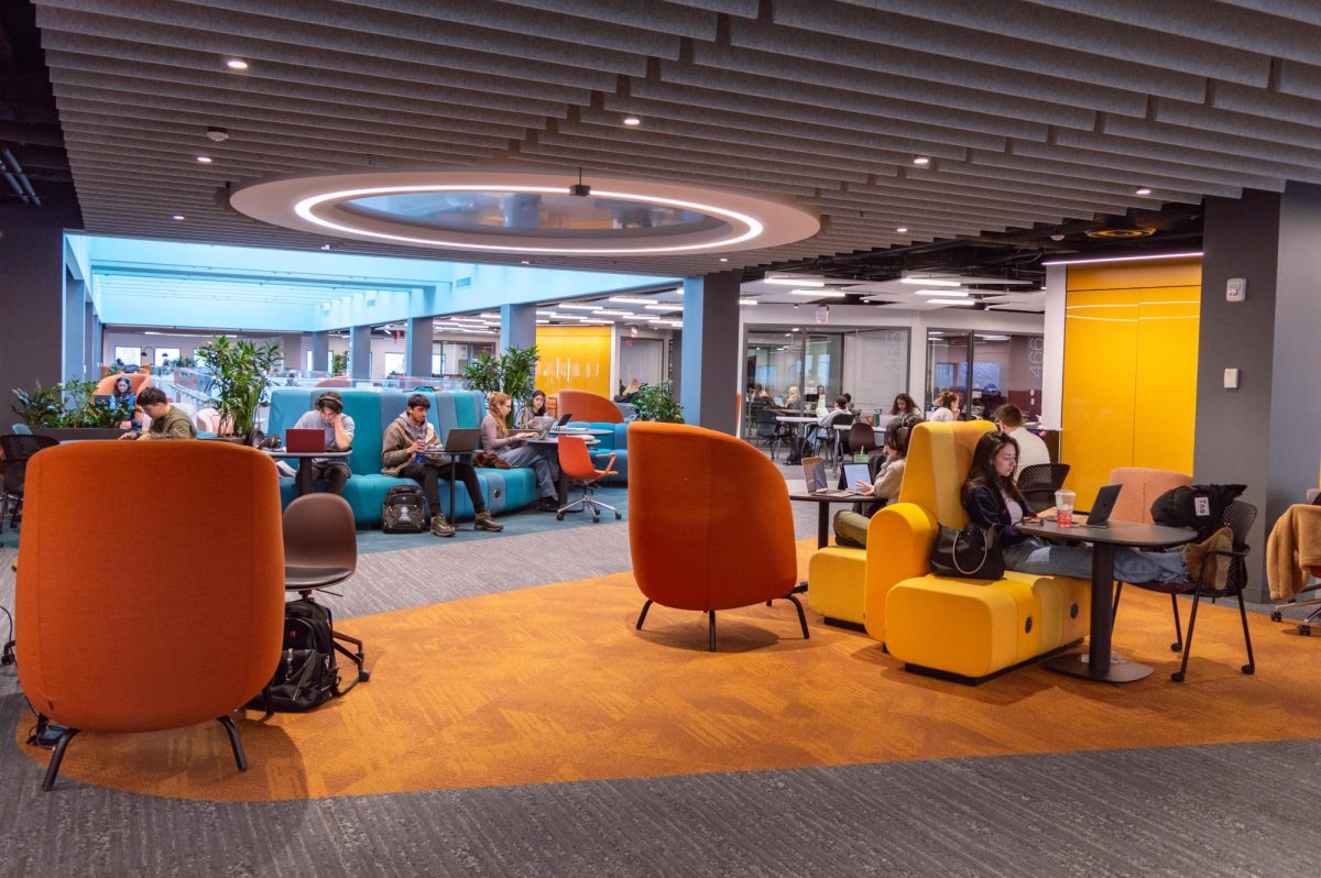 Students complete work on the newly renovated fourth floor of Snell Library. All floors were renovated with the exception of the second floor, which is still being worked on. File photo by Quillan Anderson. 