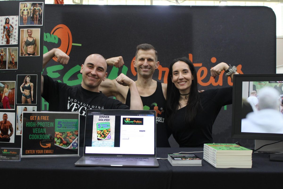 Vegan Proteins employees pose for a photo at their table. Almost 90 vendors attended the 29th annual Boston Veg Food Fest.