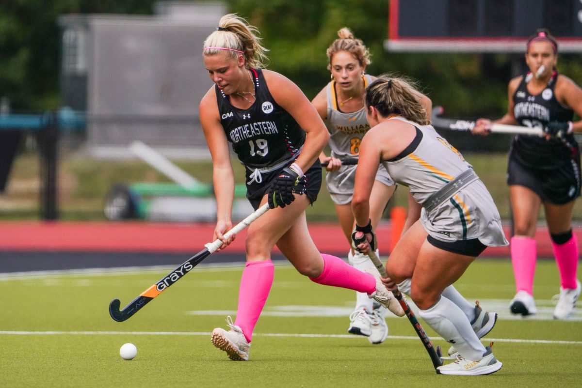 Mak Graves keeps her eyes on the ball, trying to hold possession over the Tribe Oct. 4. The Husky notched Northeastern’s fourth and final goal of the game.