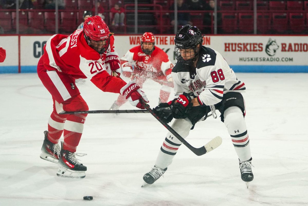 Skylar Irving fights for the puck in the 4-0 shutout over Boston University Oct. 11. She potted the game-winner against Quinnipiac University Oct. 4, getting named Hockey East Player of the Week following the performance.