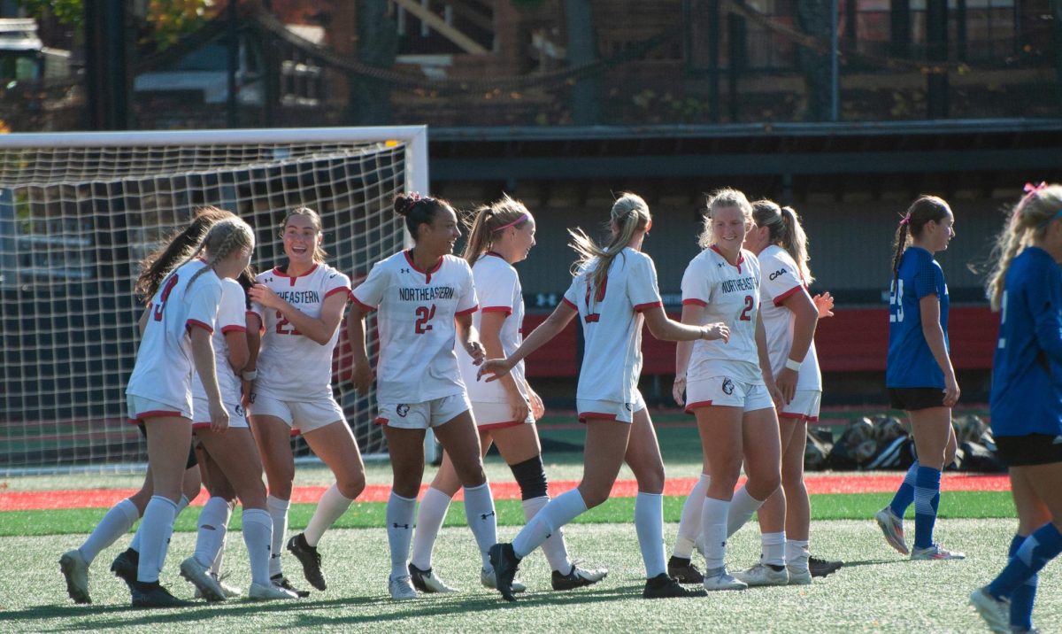 The Huskies gather together against Delaware Oct. 27. Northeastern finished the season 2-9-7, 2-4-4 CAA.