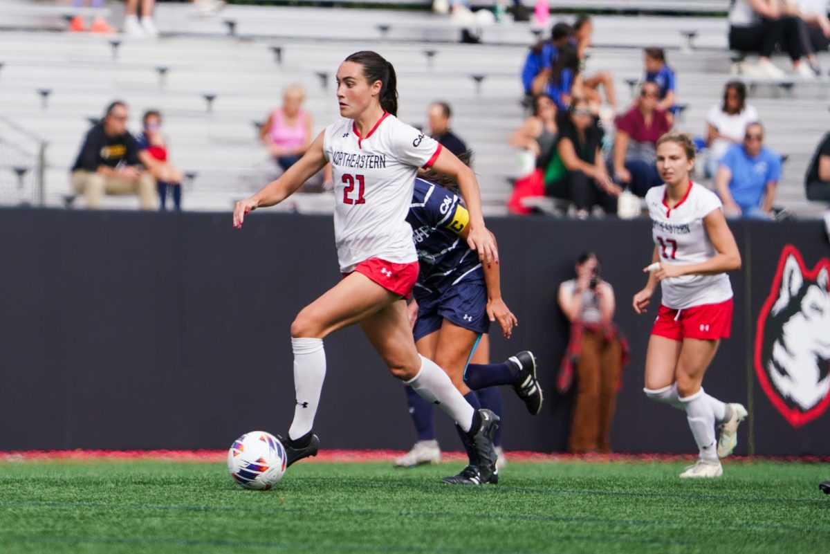 Avery LeVangie maintains possession against Monmouth Sept. 29. She scored Northeastern’s only goal of the game, her second of the season.