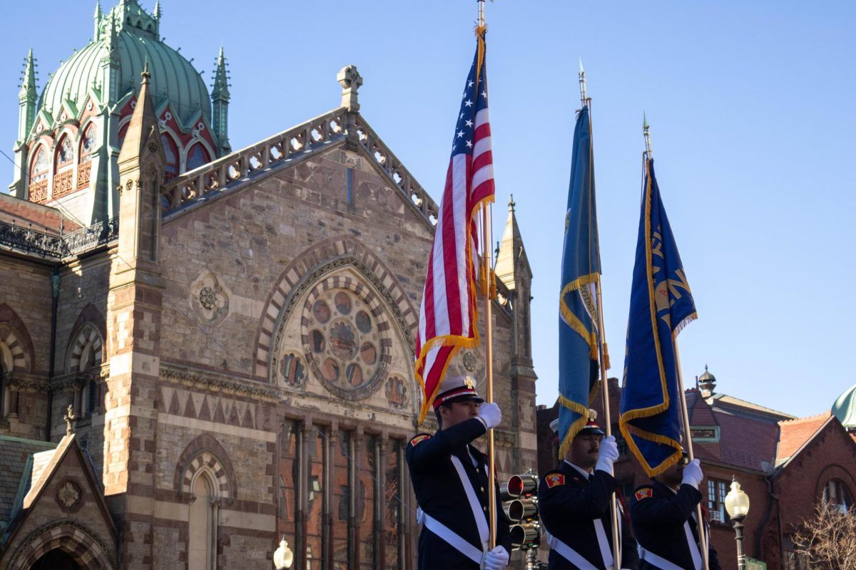 Military members carry the American, Boston and Boston Fire Department flags while passing the Old South Church during the Veterans Parade Nov. 9. Read more here.