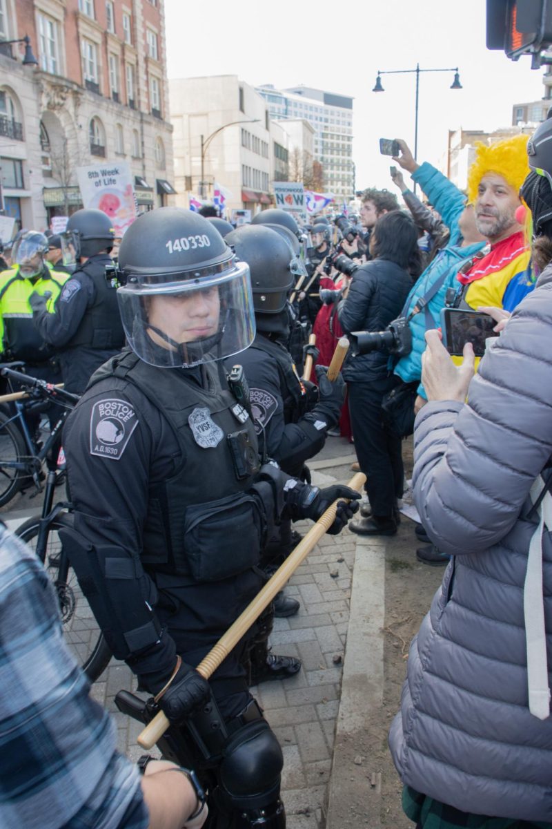 BPD officers in riot gear set up a cordon around the Men’s March contingent, warding off counterprotesters with wooden batons. The police waited for over an hour for reinforcements before pushing their lines forward and breaking through the counterprotesters.