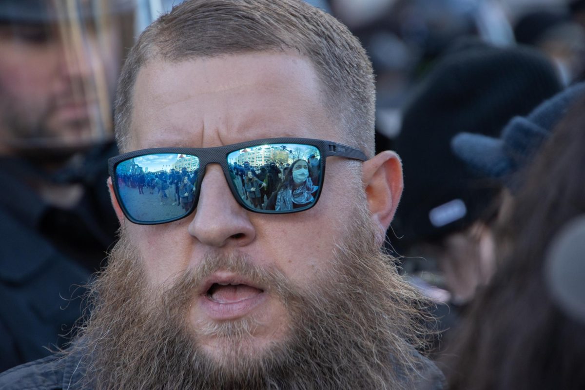 The crowd of counterprotesters is reflected in a BPD officer’s sunglasses as he shouts at the pro-choice contingent to move back. State police and members of the SERT taskforce arrived in riot gear hours after counterprotesters first blocked Commonwealth Avenue, making the crowd of police officers a mix of regular BPD uniforms, riot gear and tactical equipment.