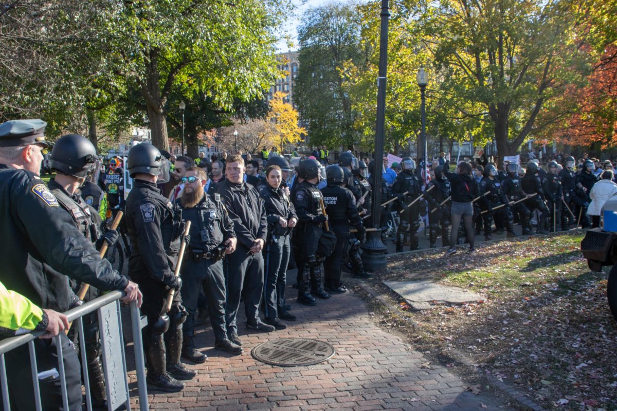 BPD officers in riot gear form a corridor to allow Men’s March participants to enter the ring of barricades around the Parkman Bandstand in Boston Common. Several members of the press tried to enter along with the anti-abortion crowd but were blocked by the police.