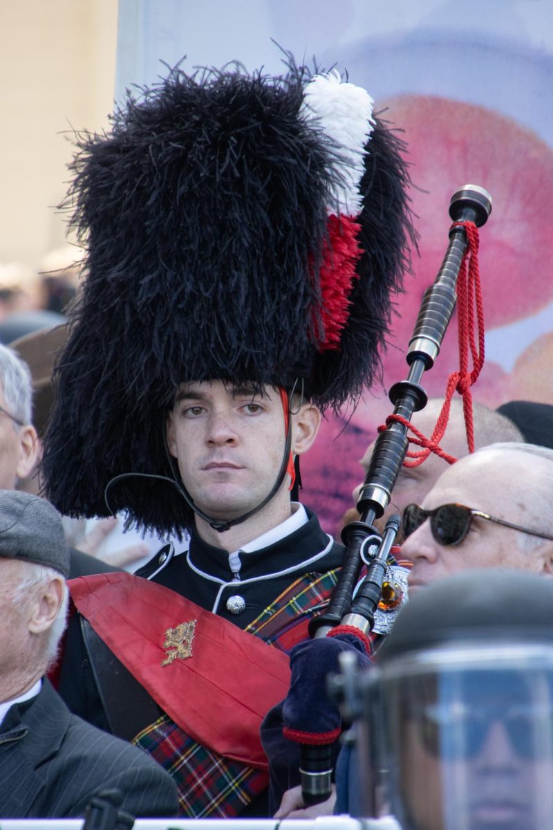 An anti-abortion activist in Scottish regalia watches the crowd of counterprotesters from behind the police line. A pair of anti-abortion activists played the bagpipes and drums as the Men’s March proceeded down Commonwealth Avenue.