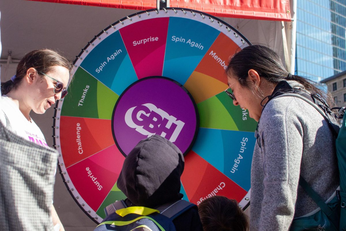 A child spins the GBH wheel to win a prize. The Book Fair offered games, music and opportunities to meet novelists and poets.