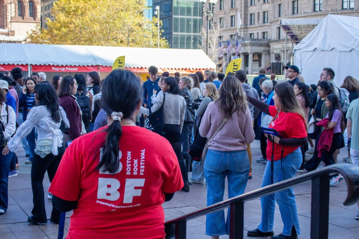 Festival goers wander the Copley Square while staff supervise and answer questions. All staff and volunteers wore custom red shirts.