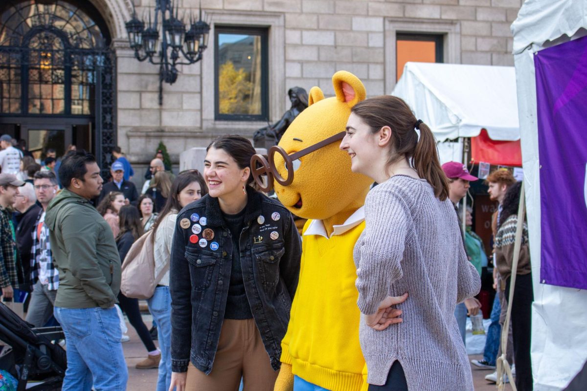 Two people pose with mascot, Arthur, from the PBS KIDS show "Arthur". Many were excited to to take photos with the iconic main character.