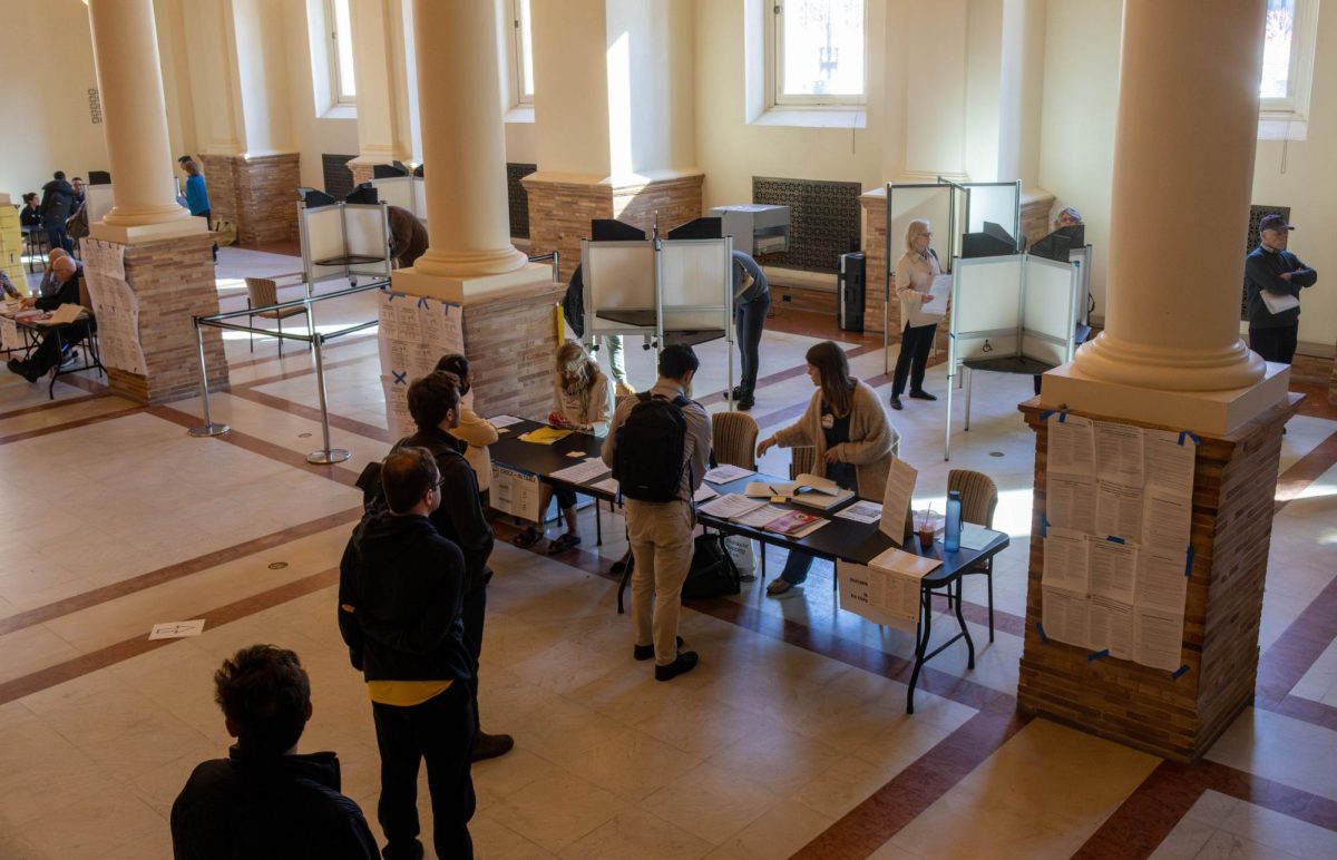 People wait in line to vote at the Copley Square branch of the Boston Public Library Nov. 5. Echo chambers became a more popular term used in social media, especially in regards to information people encounter about politics.