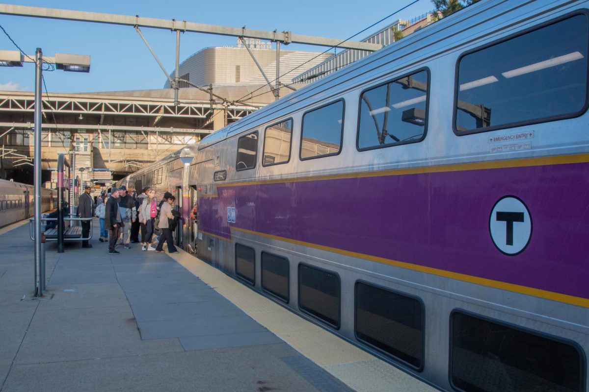 Passengers board a Commuter Rail train. Different Commuter Rail lines offered people an opportunity to explore areas outside Boston for a day.