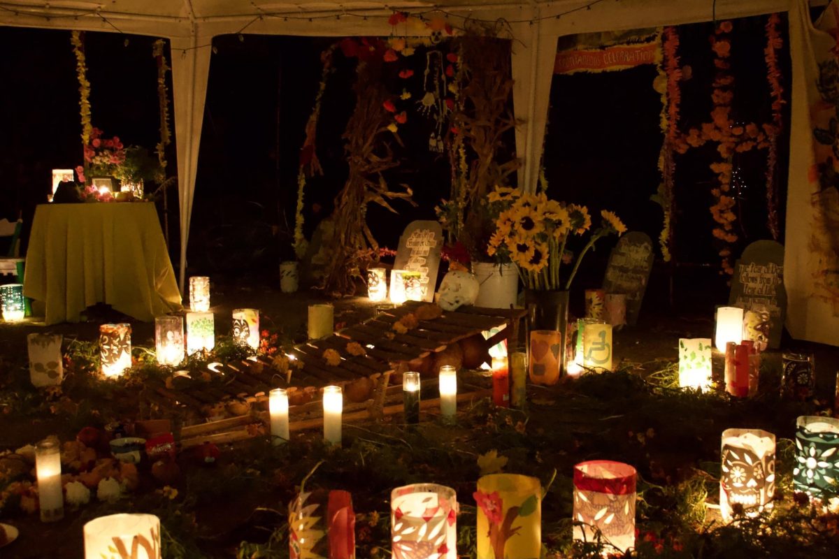 Candles and flowers decorate a shrine. Attendees of the Día de los Muertos event were encouraged to create altars for loved ones they had lost.