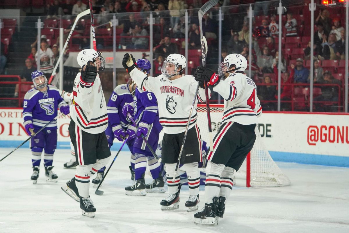 Northeastern unites on the ice against Stonehill Oct. 12. The team fell 6-5 in overtime to Providence Nov. 9, with five different Huskies potting goals.