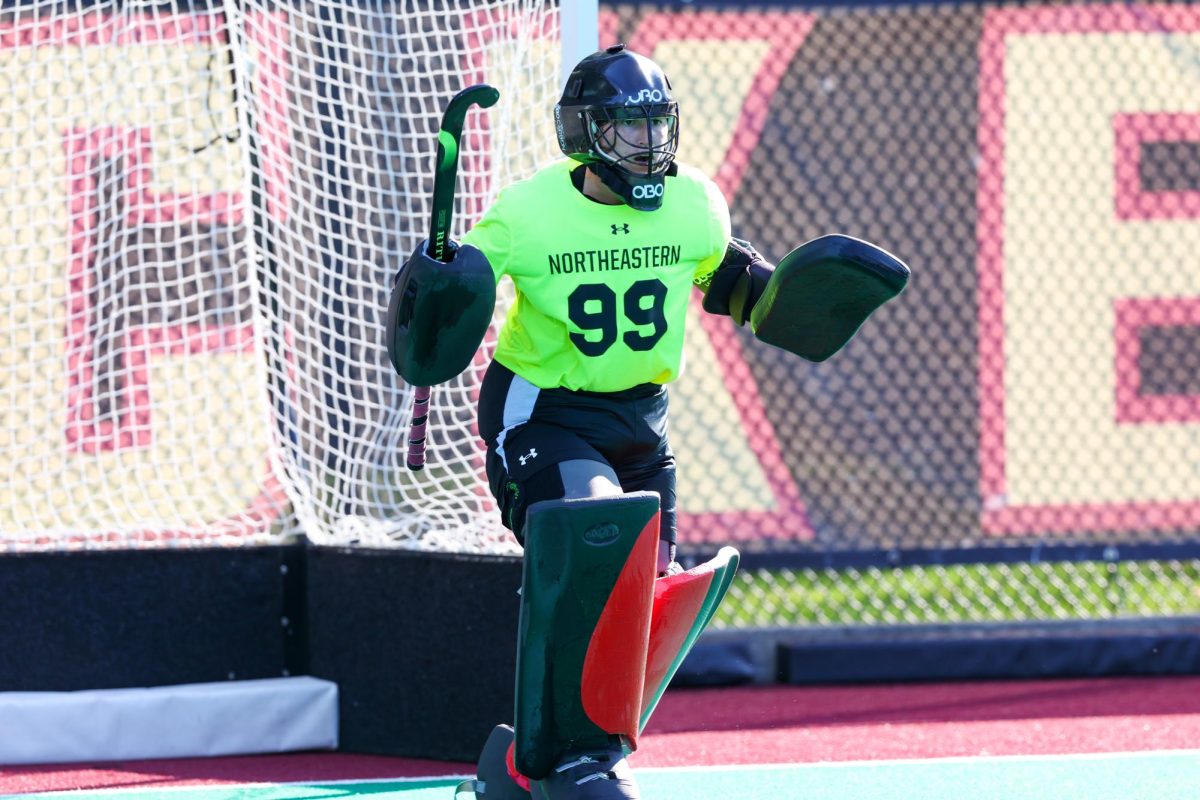 Kristi Merashoff guards the net. The Huskies fell to the University of Delaware in the first round of the CAA tournament. Photo courtesy Jim Pierce.