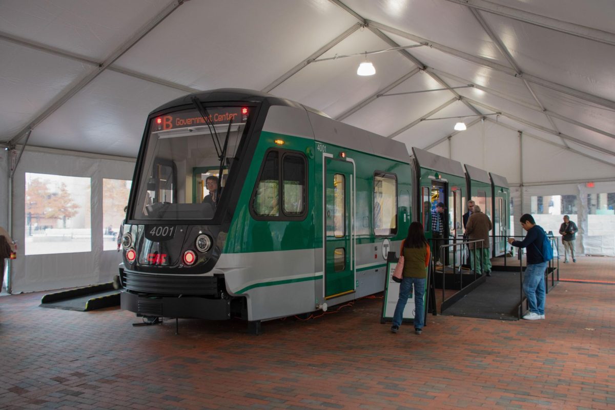 The new MBTA Green Line Type 10 train sits under a tent at the Boston City Hall Plaza. MBTA engineers and workers gave tours of the new design, showcasing its accessibility feature.