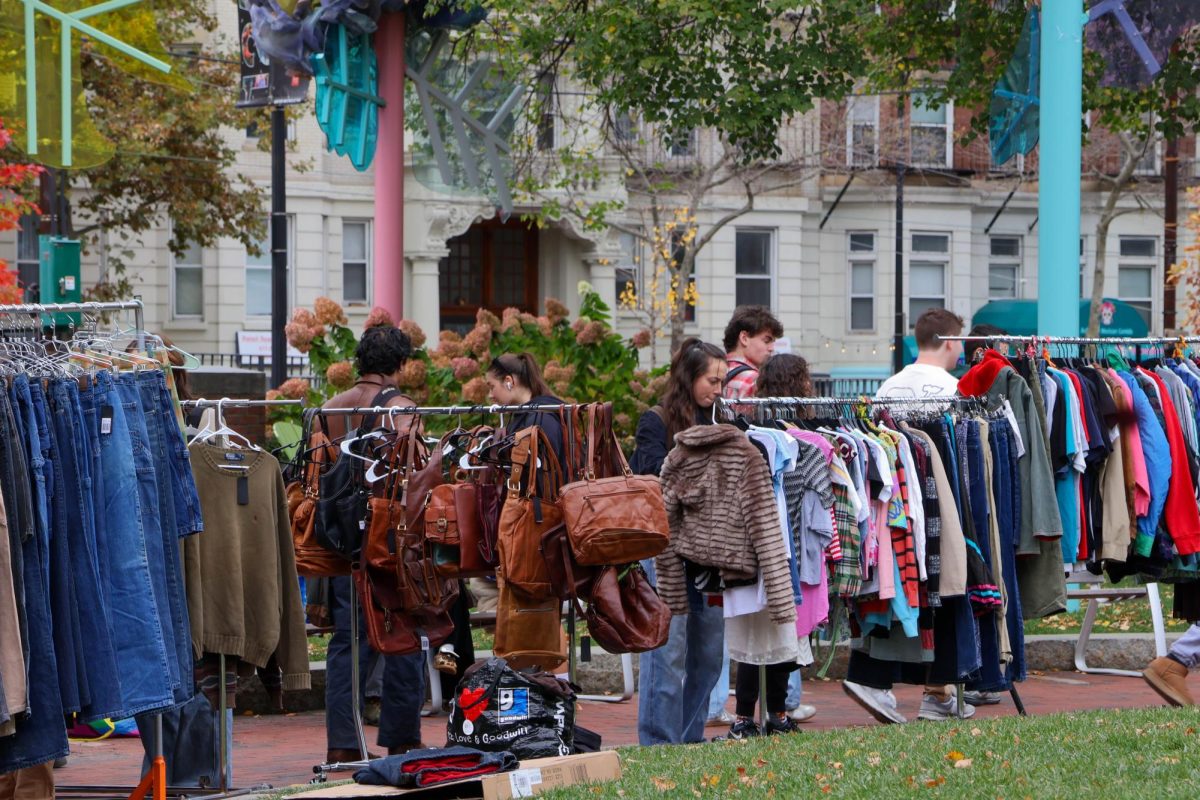 Thrifted clothing and accessories set up for students to look through and purchase. The market held an array of thrifted items, from jeans to purses to coats.