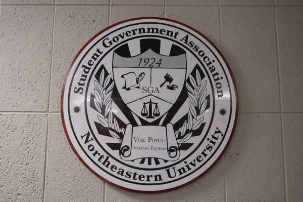 An SGA seal logo hangs in the SGA office. The SGA was founded in 1921 as the Student Council.