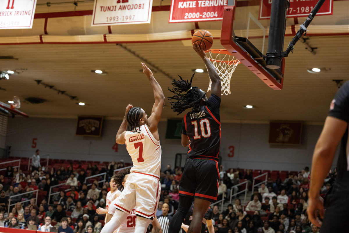 Harold Woods jumps for the basket in a victory over Boston University Nov. 4. The Huskies finished 12-20 last season and are looking for redemption.