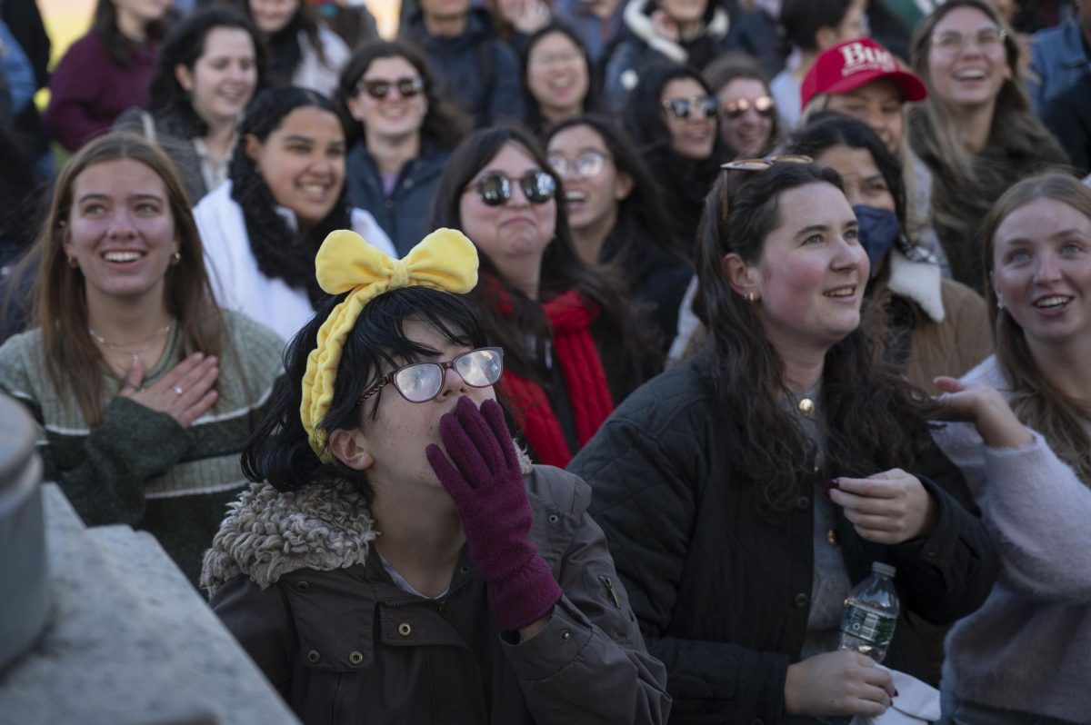 A member of the crowd puts their hand over their mouth in excitement. Most advertising for the event was through social media platforms.