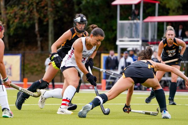 Lauren Rowe fights for possession of the ball over Virginia Commonwealth University Sept. 22. The Husky notched a team-high 10 goals and 11 assists this season.