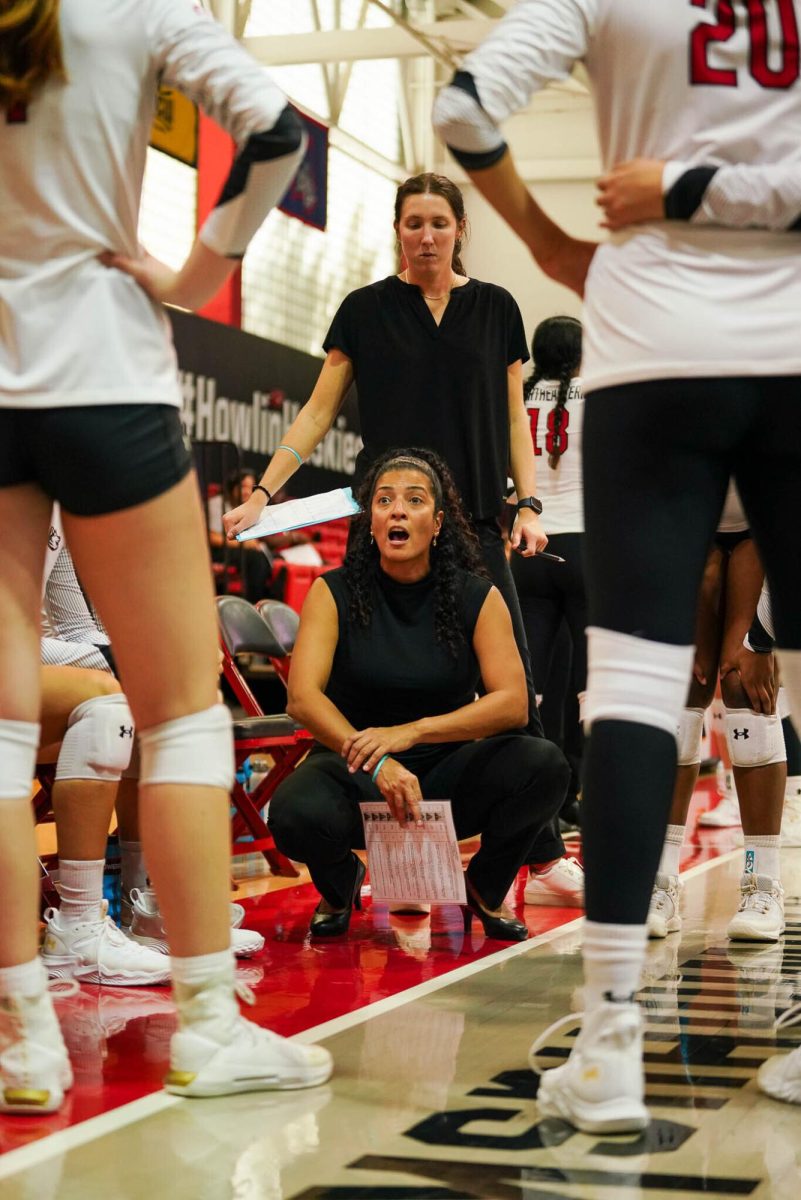 Lenika Vazquez speaks to her team during a timeout Sept. 8. She coached Northeastern’s volleyball team from 2019 to the 2024 season.