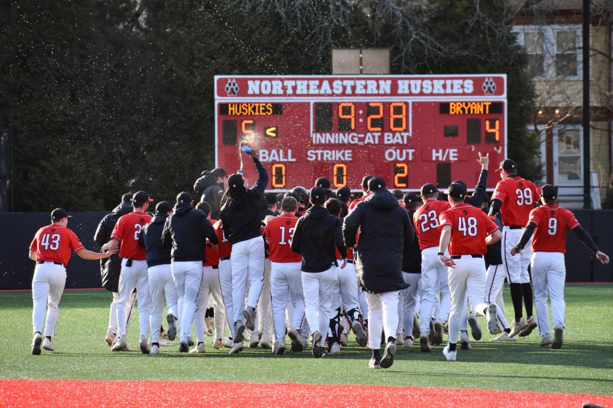 Northeastern celebrates a victory over Bryant University March 13. The team finished 38-17 last season.