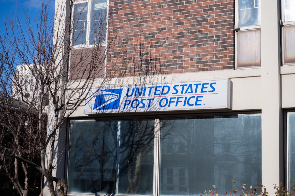 A USPS storefront sign in Mission Hill. Multiple residents wrote to city councilors in October, expressing frustrations around the delays, particularly in the days leading up to the presidential election.