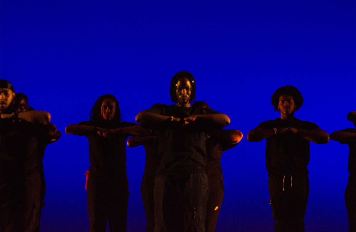 The SOAL Step Team performs under a deep blue light wearing all black clothes. Their performances were synchronized and had precise formations.