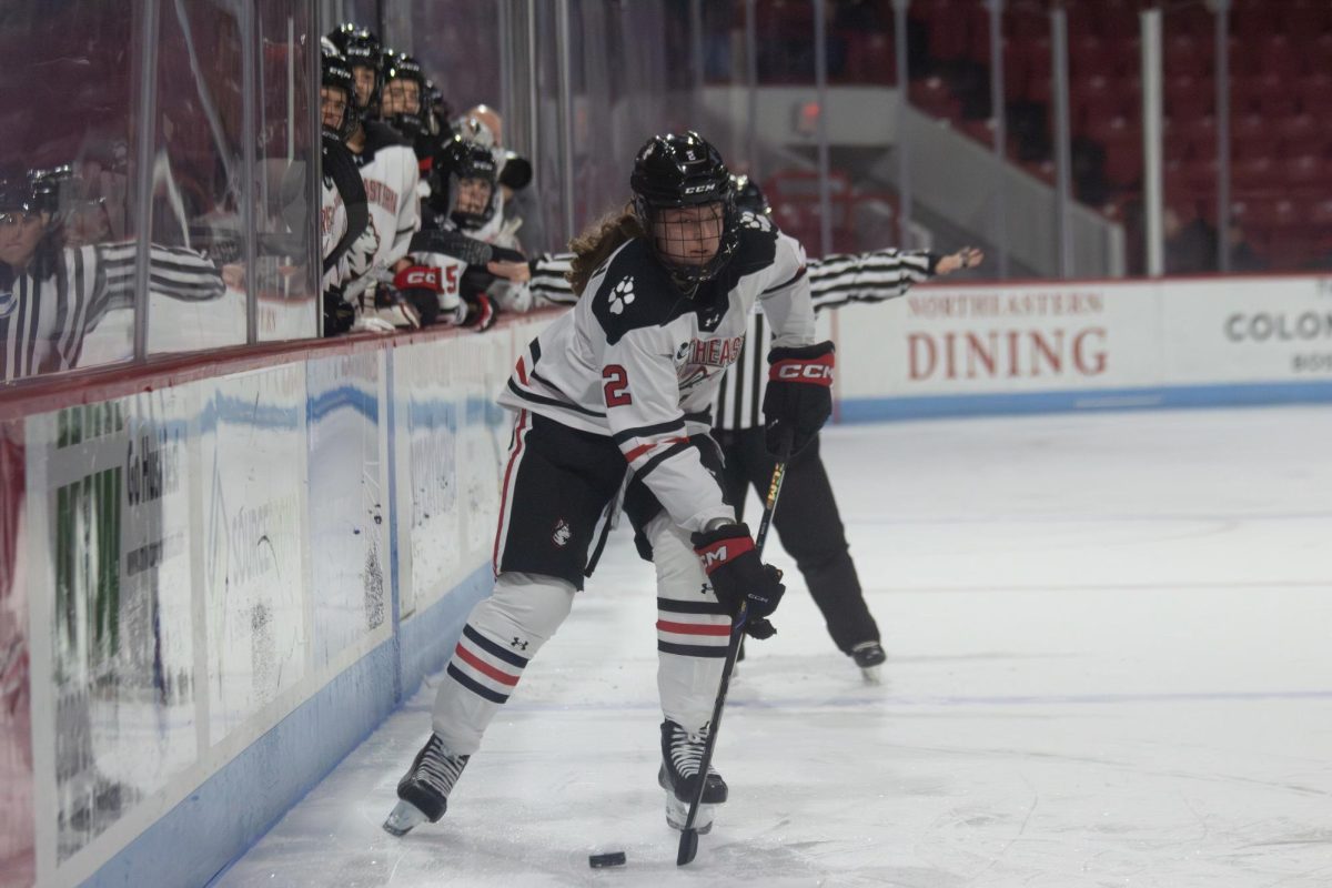 Junior forward Lily Shannon dribbles the puck against University of Maine Nov. 15. The Huskies tallied 23 shots compared to Boston College's 25 in a 3-0 loss Nov. 30.