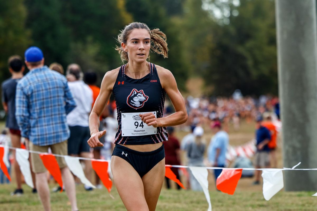 Abby Hassman runs in her last cross-country CAA championship race as a graduate student. She broke the school record for the 5,000 meter in indoor track, and also holds the record for the 6,000 meter race in cross-country. Photo courtesy Jim Pierce, Northeastern Athletics.