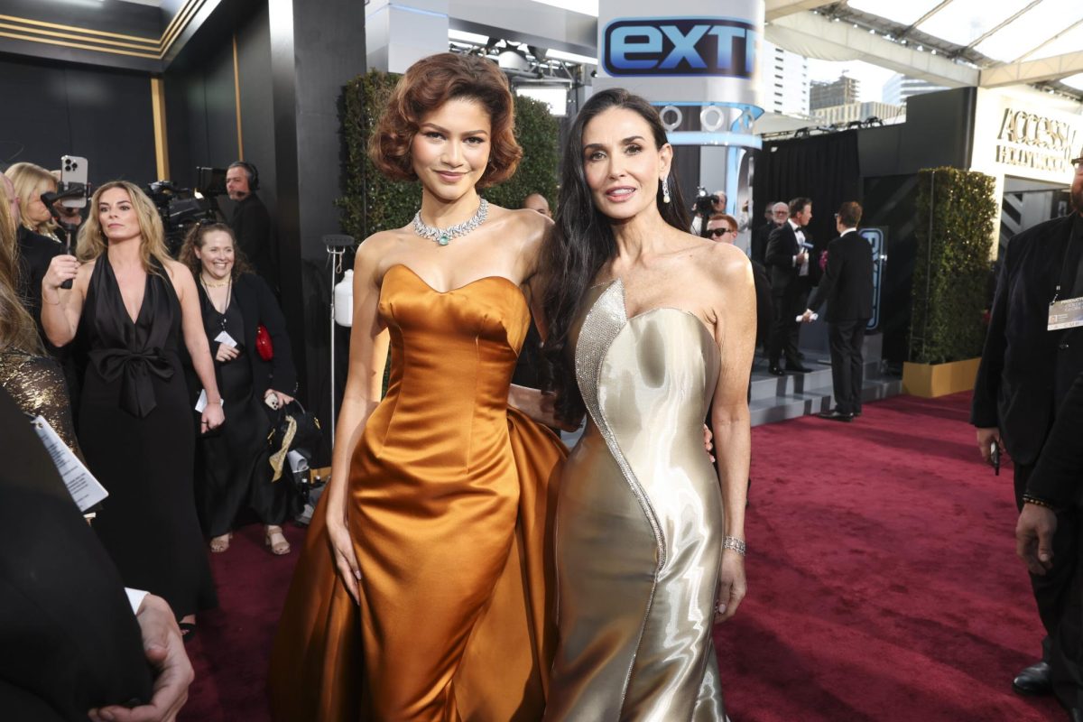 Zendaya (left) and Demi Moore pose for a photo together at the 82nd annual Golden Globe Awards. Aside from the award announcements, celebrities' glamorous red carpet looks sparked much conversation online. Photo courtesy Phil McCarten, CBS.