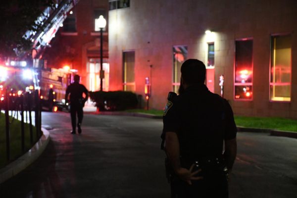 A BPD officer walks toward the scene of the bomb hoax in Holmes Hall Sept. 13, 2022. Duhaime's sentencing came over two years since the initial hoax. File photo by Avery Bleichfeld.