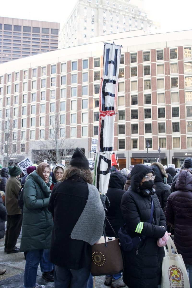 A protester holds up a handmade sign in support of Palestine. Ending the war in Palestine was one of the issues backed by We Fight Back.