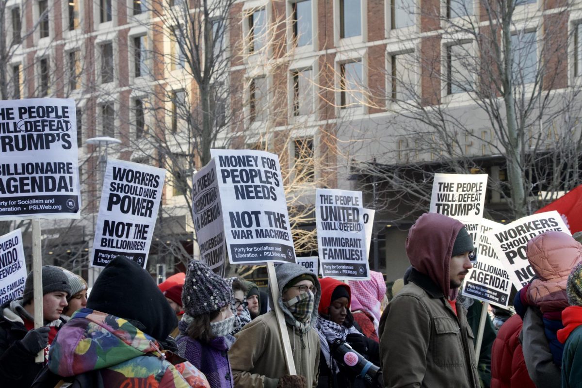 Protesters begin the march on Sudbury Street outside the John F. Kennedy Federal Building. As Trump’s inauguration was held on Martin Luther King Jr. Day, some protesters felt it was dishonorable to King’s legacy. “He fought for the rights of Black people in this country and was a strong unionist,” Dery said. “It’s really unfortunate that the timing has fallen on this day, and I think that the inauguration is not how we can honor Dr. King. I think that in this protest, we hope to honor Dr. King's legacy.”