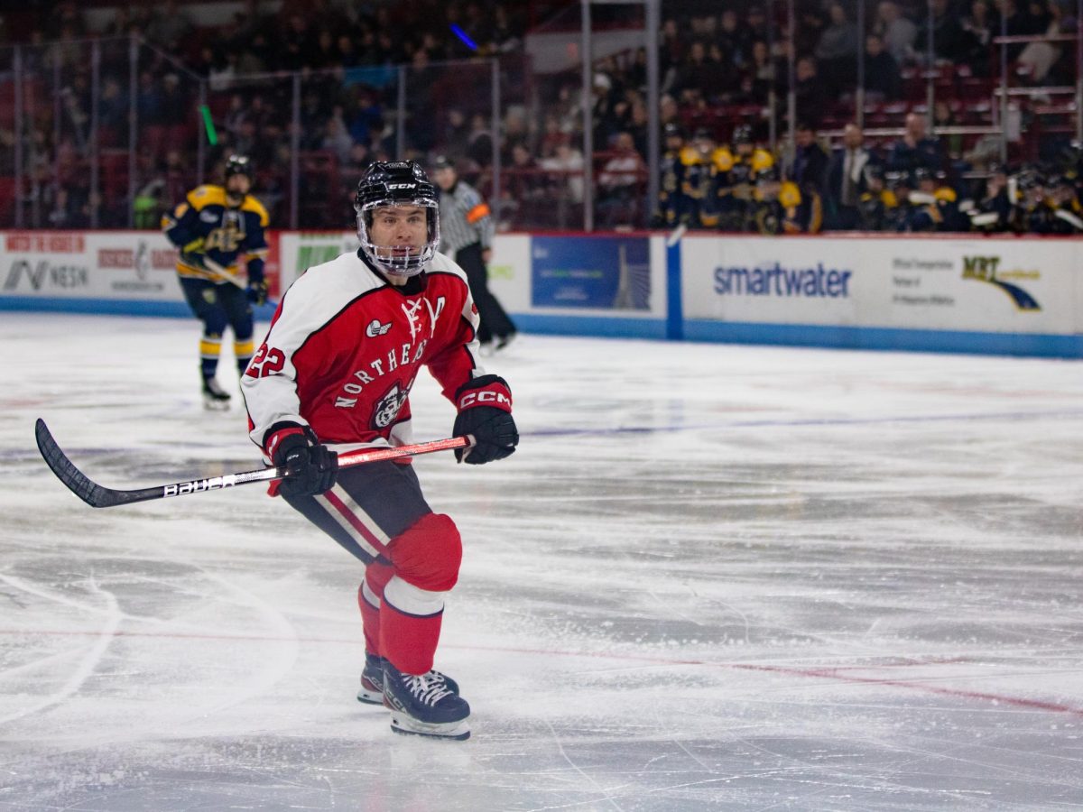 Vinny Borgesi skates down the ice to get open for a pass Jan. 26. Borgesi scored the second goal of the night against Merrimack College.