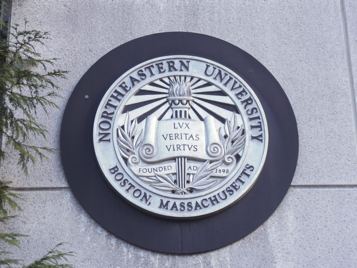 A Northeastern seal on the Boston campus. Following an executive order by Trump attacking DEI related programs Jan. 21, Northeastern took down many of its DEI programs and website pages.