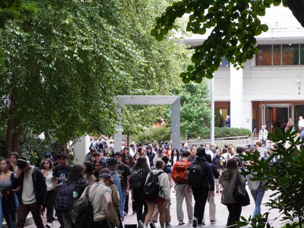 Northeastern students walk across campus to switch classes, grab lunch or return to their residential halls. The school resorted to sending students to the Sheraton Hotel or Midtown Hotel when White Hall was condemned in August 2023.