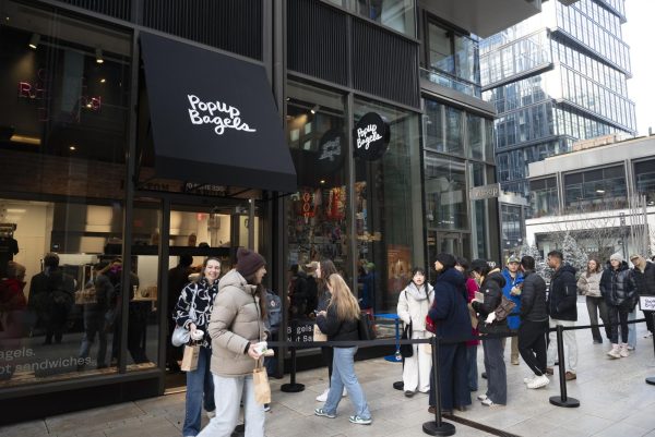 Customers wait in line outside Seaport's new PopUp Bagels store. The new location opened Jan. 10.