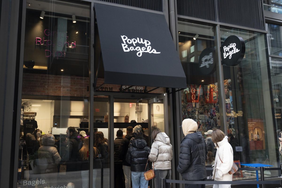 Customers line up and enter Seaport's PopUp Bagels store.