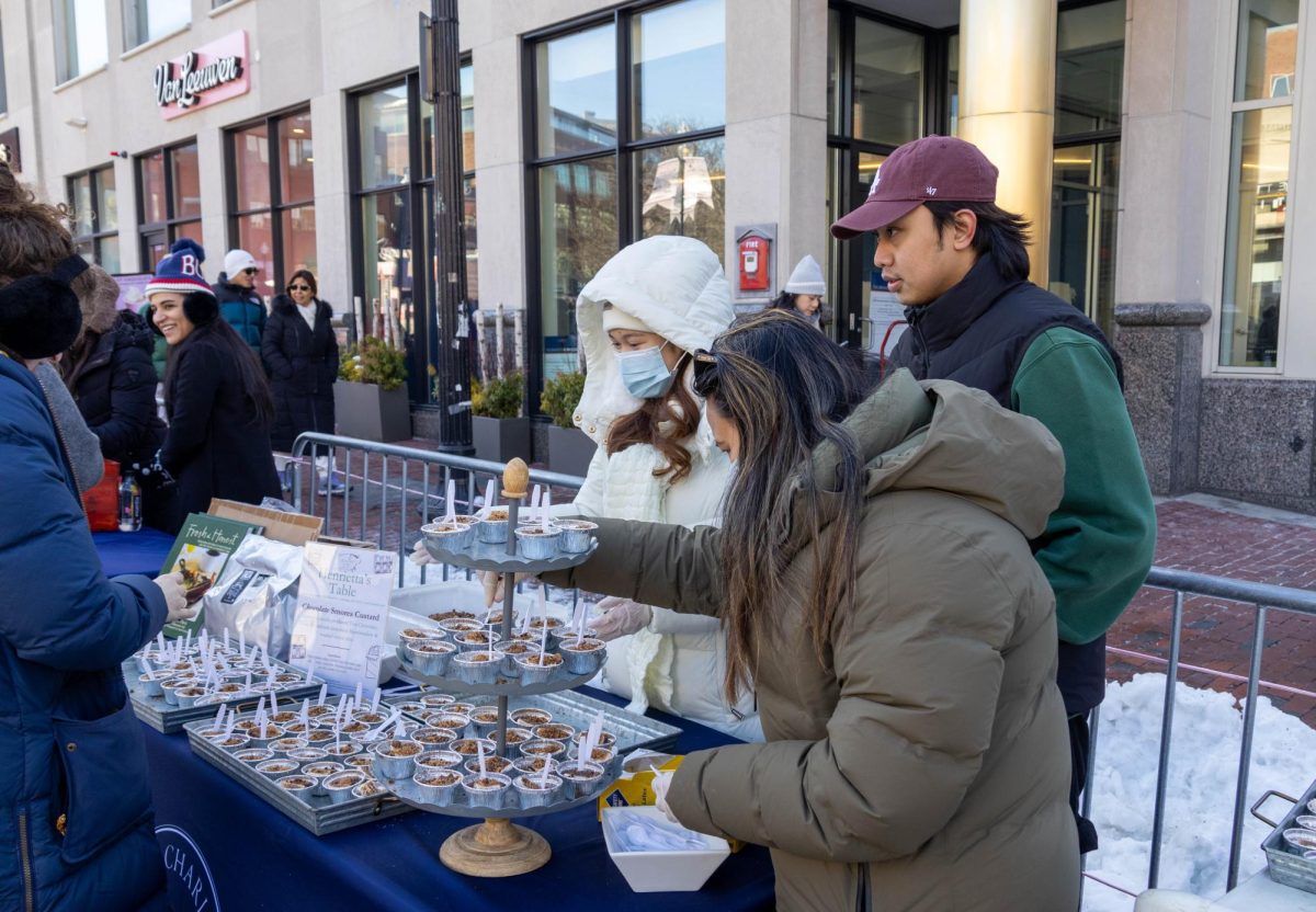 Henrietta’s Table vendors perfect their tower of s’more-chocolate treats for people to grab and try as they walk past. All of the vendors were from Harvard Square and beautifully showcased their desserts. 