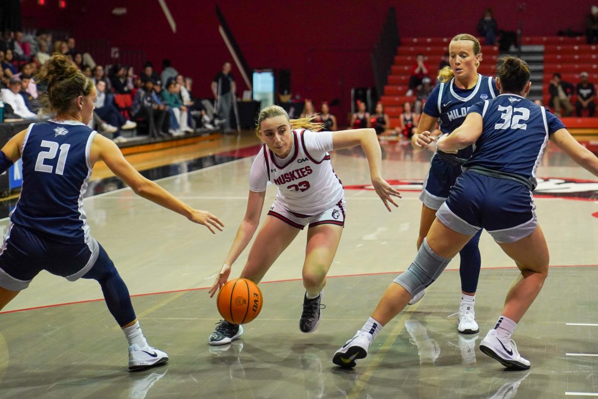 Freshman guard María Sánchez Pitarch dribbles down the court Nov. 14. Five of Towson’s points came off turnovers from Northeastern and the Huskies failed to score on any of Towson’s mistakes.