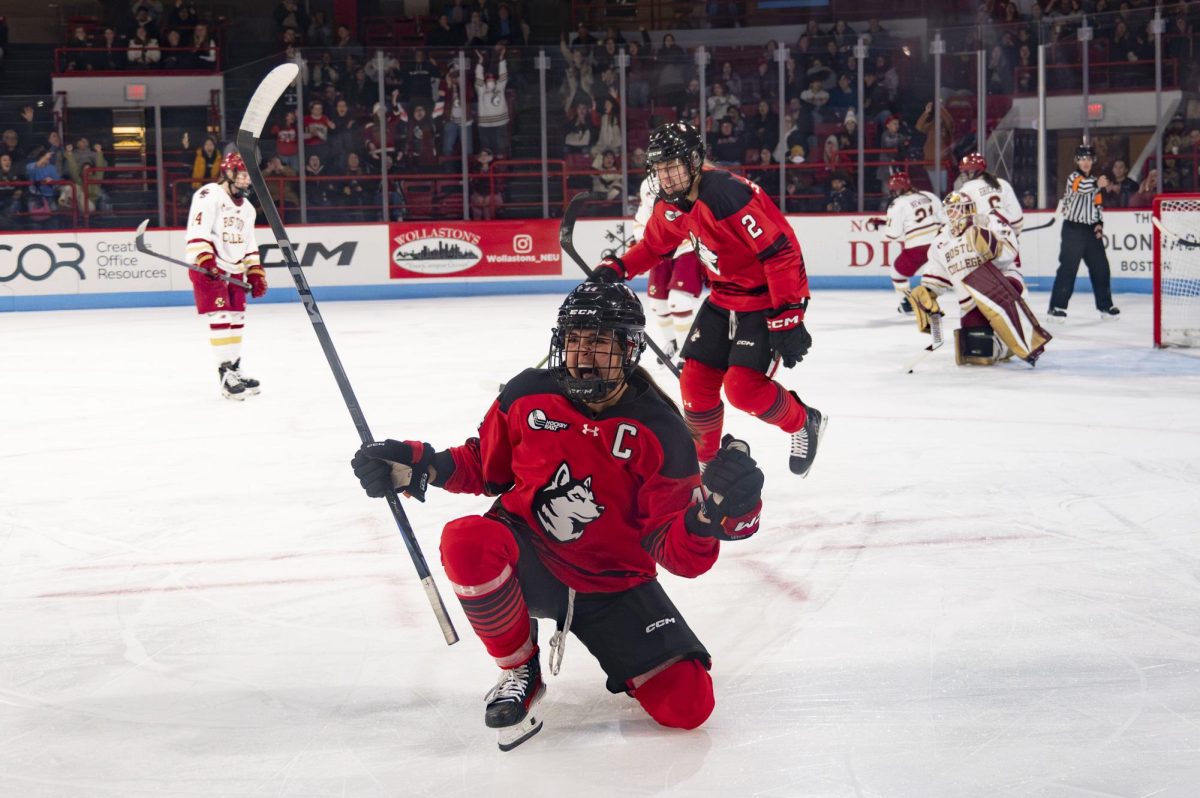 Captain and senior forward Taze Thompson celebrates after scoring the second goal of the night. The game was Northeastern’s by the end of the second period; Eagles fans dissipated while the Doghouse roared.